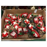 Vintage plastic santa and santa in car string