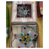 Two vintage star tree toppers