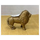 Vintage gold-toned cast iron lion still coin bank