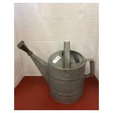 Vintage galvanized metal watering can