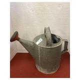 Vintage galvanized metal watering can