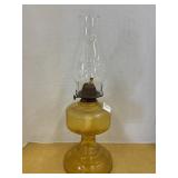 Vintage oil lamp with amber glass base