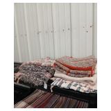 Shelf lot of 7 rugs