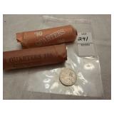 Two rolls of US centennial quarters