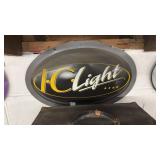 Vintage oval metal sign for IC Light beer