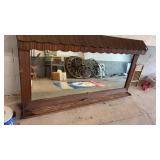 Vintage mirror with wooden house-like border and