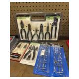 Lot of new pliers and pegboard tool holders