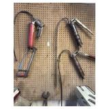 Lot of 3 greaser guns, spud wrench, and hacksaw