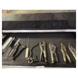 Drawer lot of locking pliers and brushes