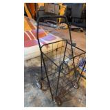 Vintage metal folding utility shopping cart on