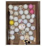 Lot of misc golf clubs and tees