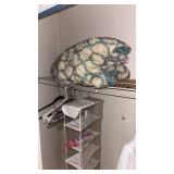 Hanging shoe rack with hangers and a comforter