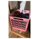 Bin of assorted winter gloves, hats, and winter