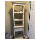 Distressed white bookshelf with scalloped edges