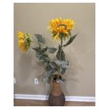 Faux sunflowers in vase