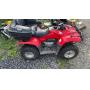 Red Honda FourTrax Recon utility ATV equipped