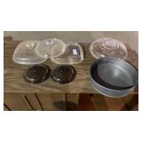 Nonstick cake pan, assortment of glass lids, and