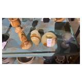 Decorative glass mini vases and a carved candle