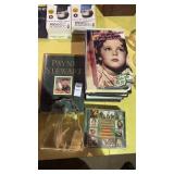 Lot of movie DVDs, golf glass decor, and a golf