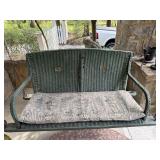 Green wicker porch swing with cushion as is