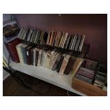 Shelf lot of assorted CDs and guidebooks