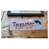 Thelma Perfume Metal Sign