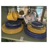Lot of yellow and blue bee dishes and geese mugs