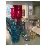 Lot of colorful shot glasses and vase