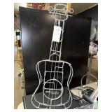Metal wire guitar shaped sculpture