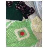 Crocheted blankets and quilted placemats