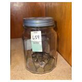 Jar of assorted year pennies