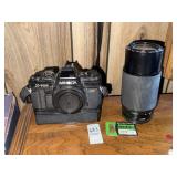 Vintage Minolta X-700 film camera with zoom lens