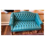 Turquoise-blue tufted leather loveseat