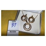 Goldtone crystal & double ring necklace & pierced