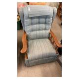 Blue recliner with wooden arms