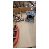 Plastic canoe , camp fire, wishing well