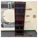 A Wooden Six-Tier Media Shelf and a Collection of