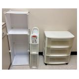 A Trio of White Plastic Storage Units Including Ru