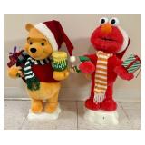 A Pair of Telco Creations Inc Animated Holiday Fig