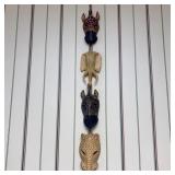 A Set of Four Hand-Carved and Painted Wood African