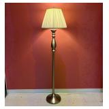 A Brushed Metal Floor Lamp with Pleated Shade