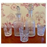 A Collection of Cut Crystal Decanters and Tumblers