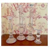 A Set of Four Graduated Clear Glass Candlesticks