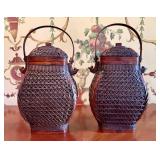 A pair of woven bamboo and red lacquer lidded bask