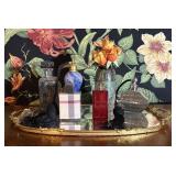 A Collection of Decorative Perfume Bottles and Van