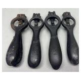 Four antique cast iron shell primers