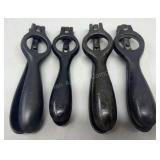 Four antique cast iron shell primers