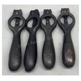Four antique cast iron shell primers