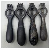 Four antique cast iron shell primers