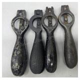 Four antique cast iron shell primers